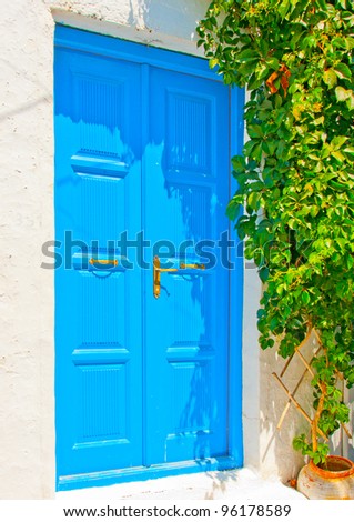 Beautiful wooden blue colored door in an old traditional house in Chora the capital of Amorgos island in Greece