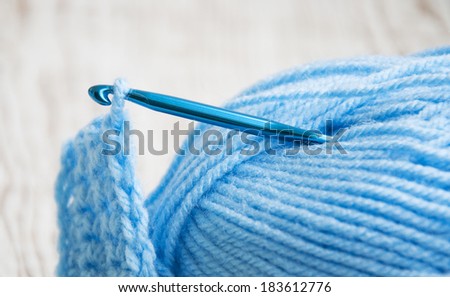 Premium Photo  Yarn for crocheting and hooks on a wooden background close  up.