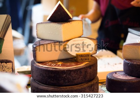 LONDON - JUN 12, 2015: Cheese shop in London. A variety of cheeses for sale at Borough Market in London, United Kingdom.