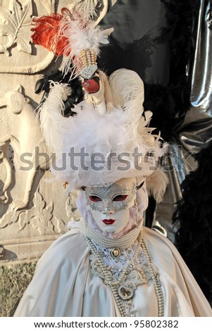 VENICE - FEBRUARY 21: An unidentified person in a carnival costume attends the end Carnival of Venice, festival end on February 21, 2012 in Venice, Italy.