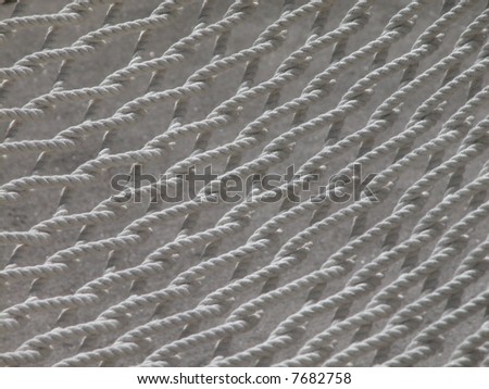 closeup of a net from a white hammock