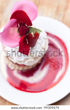 delicious strawberry short cake with beautiful topping on white plate