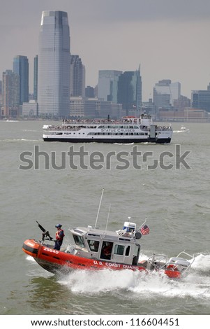 NEW YORK CITY, USA - JUNE 10: U.S. Coast Guard boat patrolling in front of Manhattan. June 10, 2012 in New York City, USA