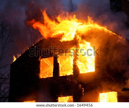 Wooden house burning.