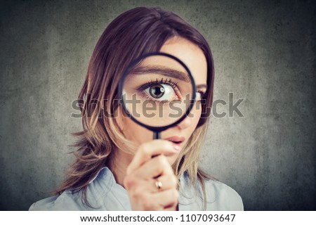 Similar – Image, Stock Photo Woman with big eye looking through a magnifying glass