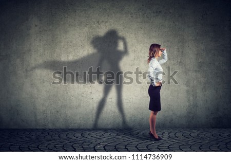 Side view of a business woman imagining to be a super hero looking aspired.  Stock foto © 