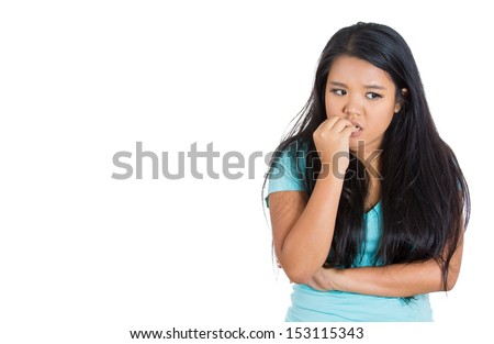 Closeup portrait of a nervous woman biting her nails craving for something or anxious, isolated on white background with copy space