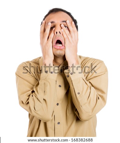 Closeup portrait of shocked, horrified, worried, stressed, overwhelmed  guy, student with hands on face, isolated on white background. Negative human face emotions, expressions, feelings, perception