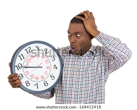 Closeup portrait of a business man, student, leader holding a clock very stressed, pressured by lack of time, running out of time, late for the meeting, isolated on a white background. Emotions