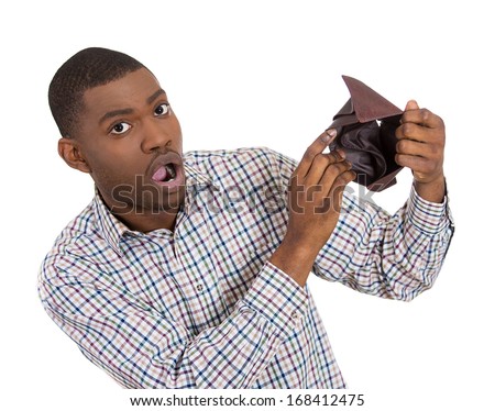 Closeup portrait of stressed, upset, sad, unhappy young man standing with, showing you empty wallet, isolated against white background. Financial difficulties, bad economy concept. Negative emotion