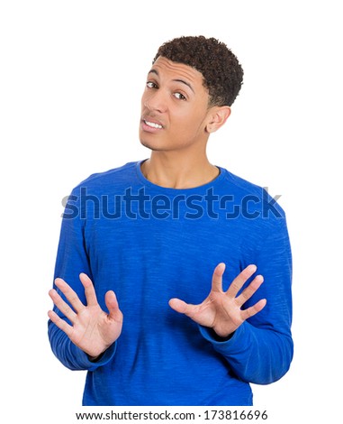 Closeup portrait of handsome unhappy, mad young man, raising hands up to say, no stop right there, isolated on white background. Negative human emotions, facial expressions, feelings, signs symbols