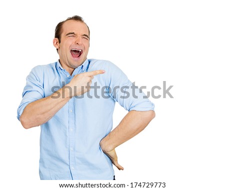 Closeup portrait of young man, laughing, pointing with finger, arms at someone, something, isolated on white background. Positive human face expression, emotion, feelings, attitude, approach, reaction