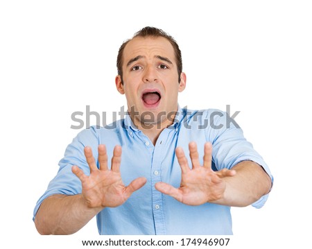 Closeup portrait of angry helpless young man raising hand up to say no stop right there, isolated on white background. Negative emotion facial expression feelings, signs symbols, body language