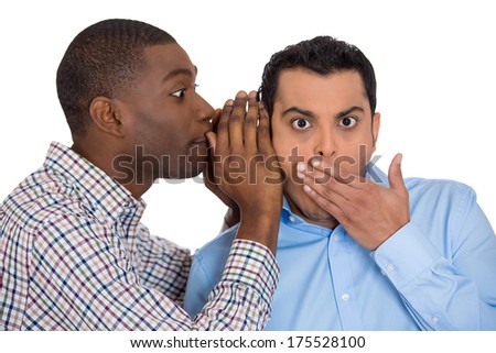 Closeup portrait of guy whispering into man\'s ear telling him something secret and disturbing. Shocked surprised disbelief wide open mouth response. Negative human emotions facial expression feelings