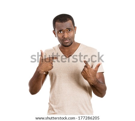 Closeup portrait of an angry, unhappy, annoyed young man, getting mad, asking question you talking to, mean me? Isolated on white background. Negative emotions, facial expressions, feelings, reaction