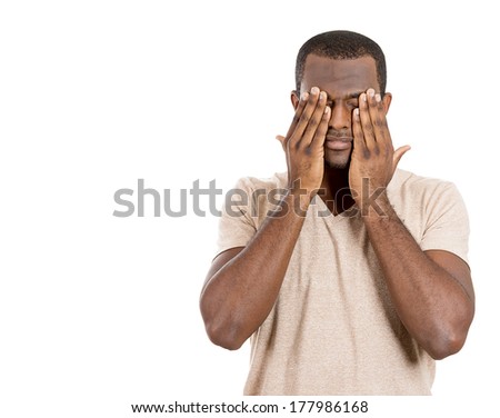 Closeup portrait of young male, shy man closing covering eyes with hands can\'t see, hiding, isolated on white background. See no evil concept. Negative human emotion facial expression feeling reaction