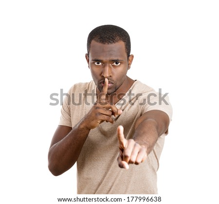 Closeup portrait of young serious man, coach, guy, student, leader placing finger on lips to say shhh, be quiet silence isolated on white background. Facial expressions, human emotions, signs, symbols
