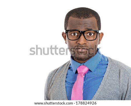 Closeup headshot portrait of handsome nerdy young man with serious concerned look on his face, isolated on white background. Negative emotion facial expression feelings, reaction, perception