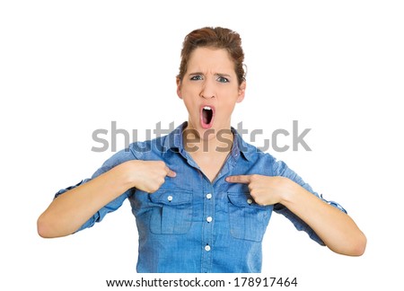 Closeup portrait of angry, unhappy, upset, annoyed young woman, getting mad, asking question: you talking to me, you mean me? Isolated on white background. Negative human emotions, facial expressions