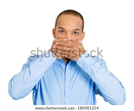 Closeup portrait of silent young man covering closed mouth observing. Speak no evil concept, isolated white background. Negative human emotions, facial expressions signs, symbols. Media news coverup