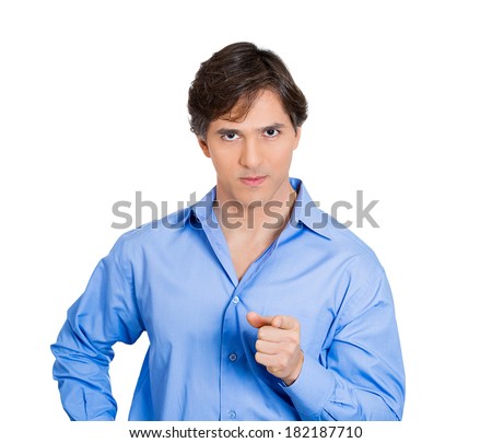 Closeup portrait of serious young handsome man pointing at you with index finger hand sign gesture, isolated on white background. Negative human emotion facial expression feelings, symbols