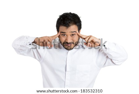 Closeup portrait, worried young man, having really bad headache, hurt, pain placing fingers, hands on temples, isolated white background. Negative emotions, facial expressions feelings, body language