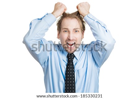 Closeup portrait, stressed, frustrated, crazy man, pulling his hair out, having panic attack, isolated white background. Negative human face expressions, emotions, feelings, attitude, perception