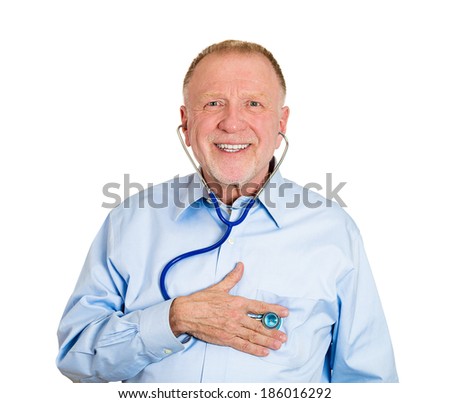 Closeup portrait, senior mature business man, male employee, worker listening to his heart with stethoscope isolated white background. Preventive medicine financial condition check-up concept