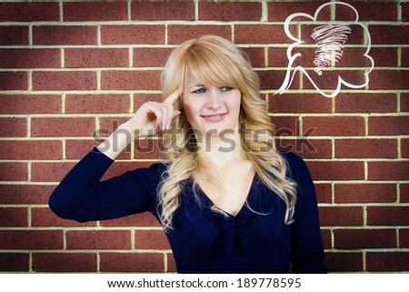 Closeup portrait annoyed, unhappy, displeased woman gesturing finger against temple, are you crazy? do you have wind in your head, isolated brick wall background. Negative emotion facial expression