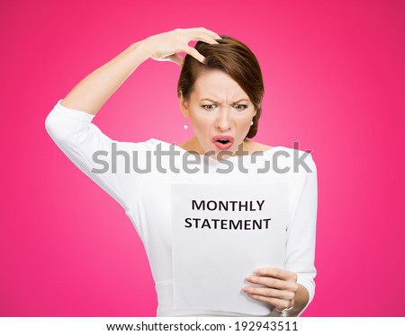 Closeup portrait shocked, funny looking business woman, disgusted at monthly statement, can\'t believe her eyes, isolated pink background. Negative human emotion, facial expression, feeling. Bad news