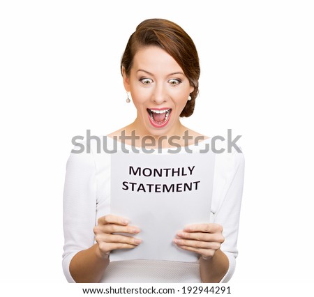 Closeup portrait happy excited young business woman looking at monthly statement glad to pay off bills, isolated white background. Positive emotions, facial expressions. Financial success, good news