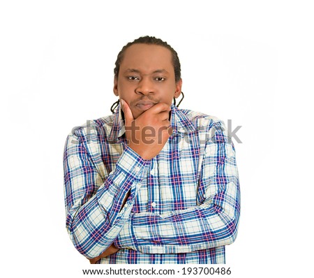 Closeup portrait skeptical young man, looking suspicious, disgust on face, mixed disapproval, isolated white background. Negative human emotions, facial expressions, feeling, reaction, life perception