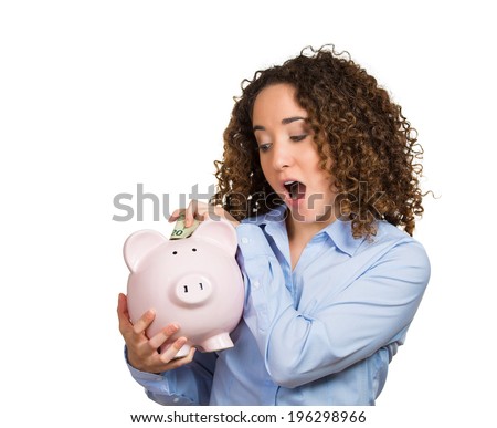 Closeup portrait happy business woman bank employee, student depositing money in piggy bank, excited to open savings account isolated white background. Financial concept. Positive emotion, expression