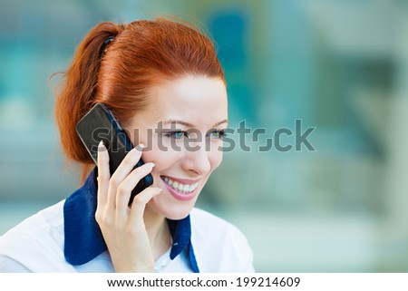 Closeup portrait, headshot happy, smiling businesswoman talking on mobile phone. Business woman having conversation on cellphone isolated corporate office windows background. Communication concept