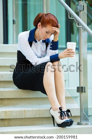 Closeup portrait unhappy business woman, head on hand sitting on stairs bothered by mistake having bad headache isolated background outside corporate office. Negative human emotions, facial expression