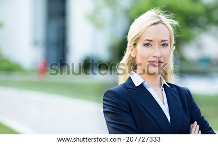 Closeup headshot portrait, young beautiful blonde business woman, confident lawyer, smiling isolated corporate office background. Positive human emotions, facial expressions, attitude, life perception