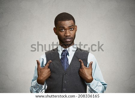 Closeup portrait angry, unhappy annoyed, rude young executive man, getting mad asking question you talking to, mean me? Isolated grey background. Negative emotion facial expression feeling attitude