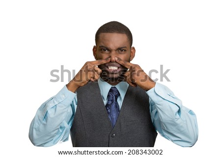 Closeup portrait young executive man, disgust on face, pinches his nose, something stinks, bad smell, situation isolated white background. Negative emotion facial expression, perception body language