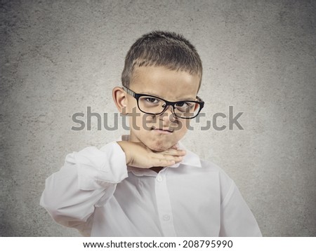 Closeup portrait angry young bitter boy gesturing with hand to stop talking, cut it out, he will take your head off isolated grey background. Negative emotion, facial expression feelings body language