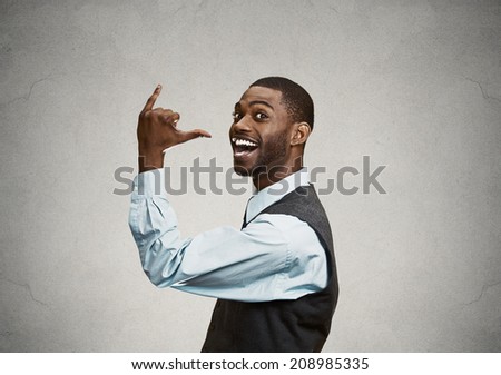Closeup portrait happy silly goofy Man Gesturing with Hand thumb to go out Party get drunk, hammered, wasted, isolated grey background. Positive emotion Facial Expression feeling, sign, Body Language