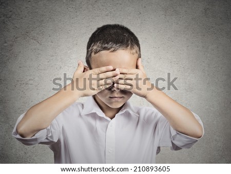 Closeup portrait of young handsome man closing, covering eyes with hands can\'t see, hiding, isolated grey wall background. See no evil concept. Human emotions, facial expressions, feelings, reaction