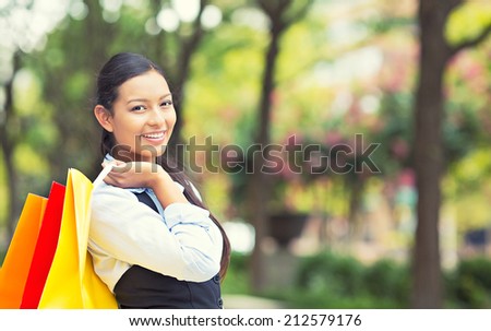 Portrait Shopping woman in Washington DC City. Beautiful model happy, smiling summer shopper holding shopping bags walking outside background outdoor park. Positive emotions, facial expressions.