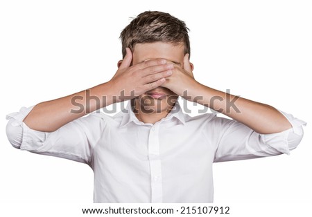 Portrait young shy man closing covering eyes with hands can\'t see, hiding, isolated white background. See no evil concept turning wrongful in good. Human emotion facial expression feeling reaction