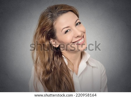 beautiful smiling girl on grey wall background. positive human emotions, face expressions, feelings