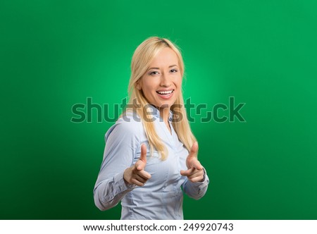 Happy woman with two thumbs up guns hand gesture pointing at you camera
