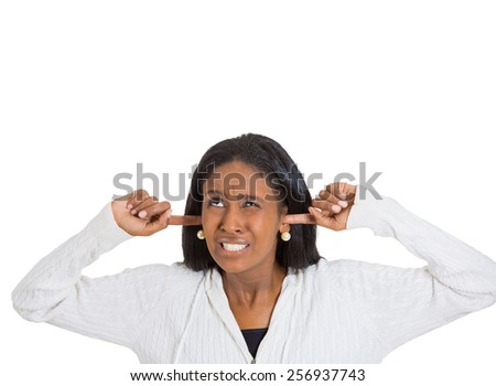Portrait middle aged annoyed, unhappy, stressed woman covering her ears, looking up stop making loud noise isolated on white  background with copy space. Negative emotion face expression reaction