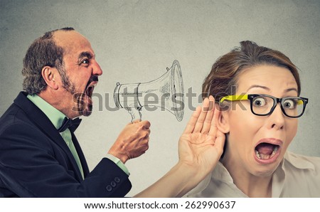 Side profile angry man screaming in megaphone curious nosy woman listening  isolated on wall background. Negative face expression emotion feeling. Propaganda breaking news social media power concept