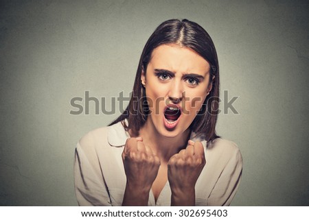 Closeup portrait angry frustrated woman screaming isolated on gray wall background. Negative emotion, feelings