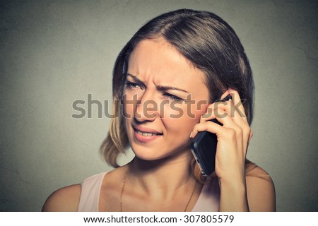Portrait upset sad annoyed unhappy woman talking on cell phone. Negative human emotion facial expression feeling, life reaction. Bad news
