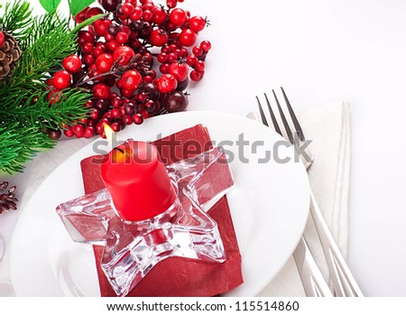 Christmas table layout, multi-colored tape with a branch of berries